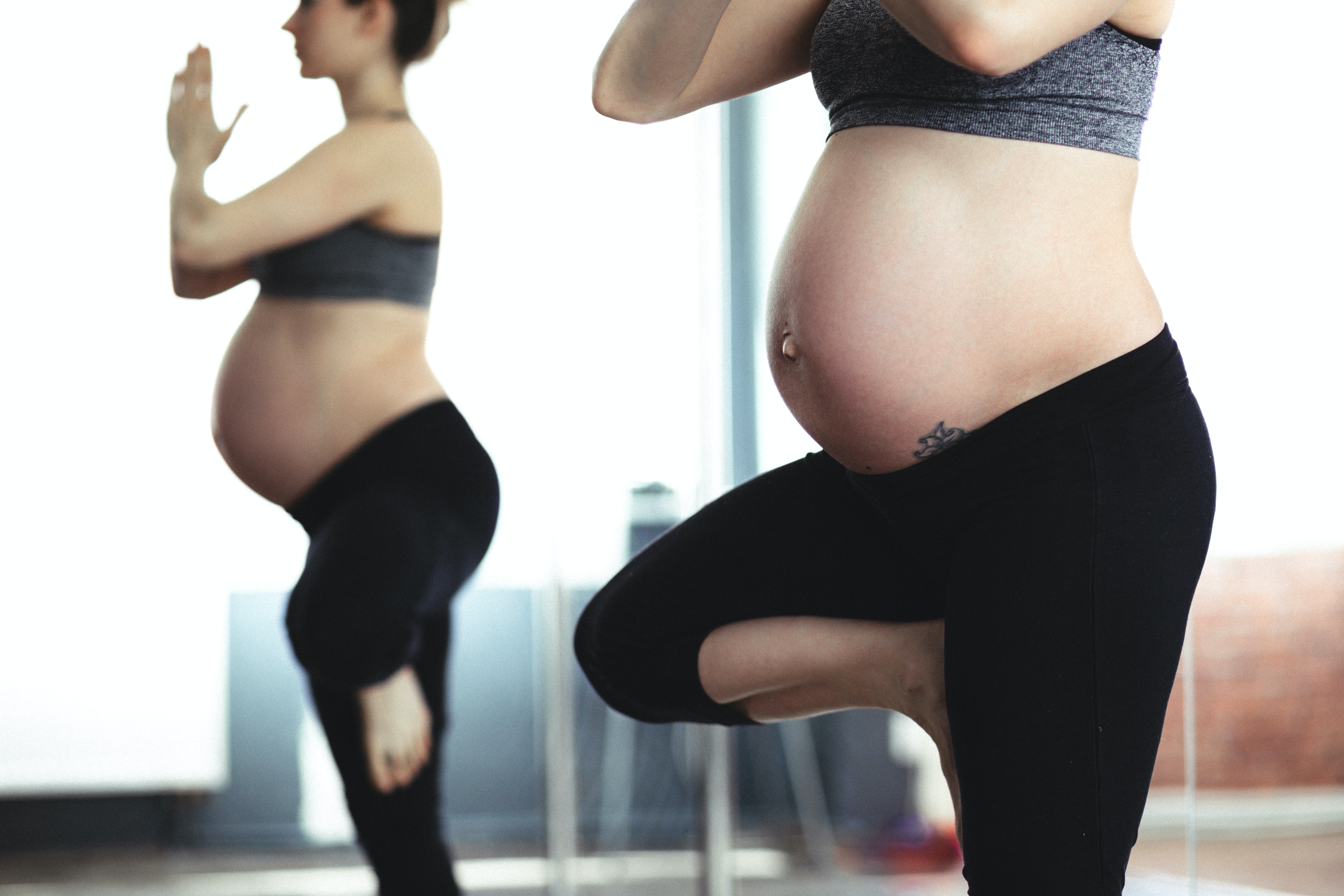 Pregnant Woman practicing tree pose