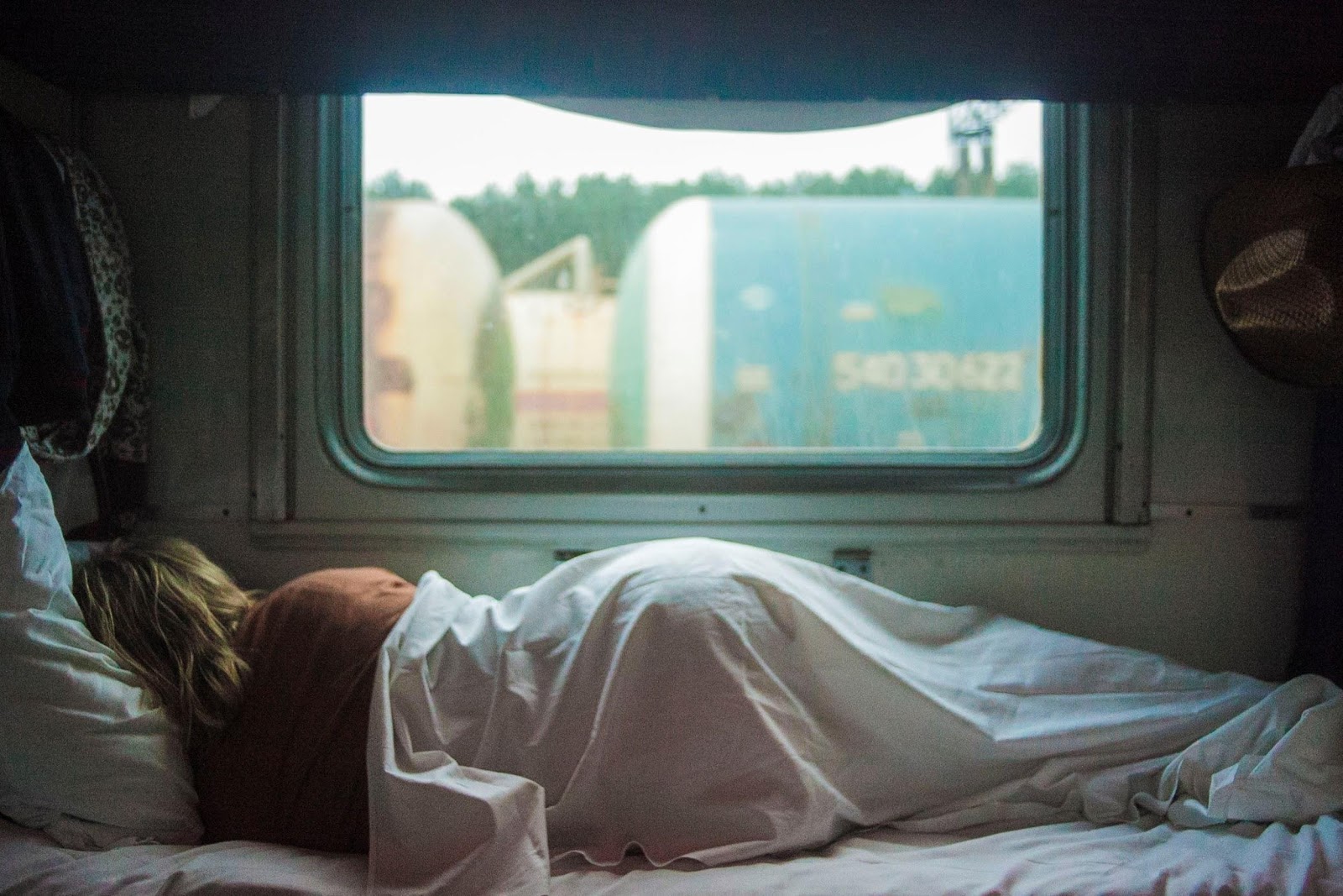 Girl sleeping in campervan